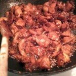 teriyaki sesame chicken in glazing process